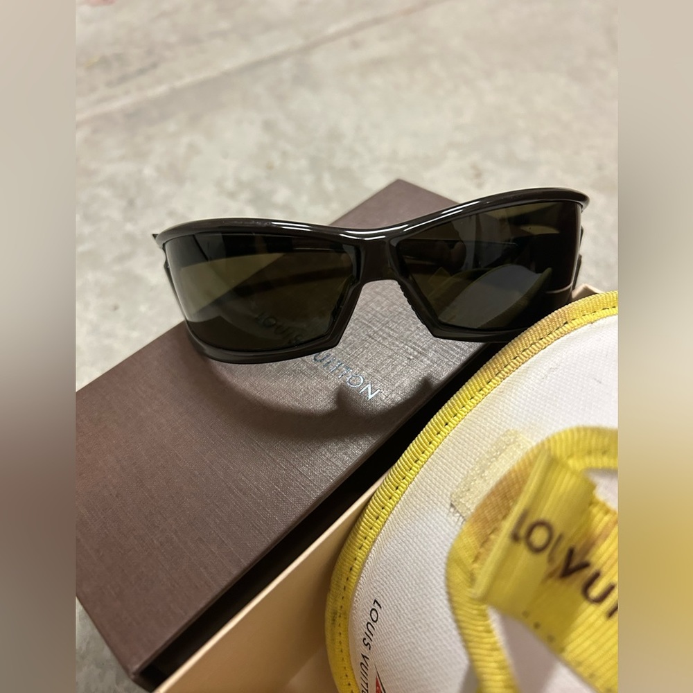 Louis Vuitton Sunglass with case and jogging strap. Deep brown shades